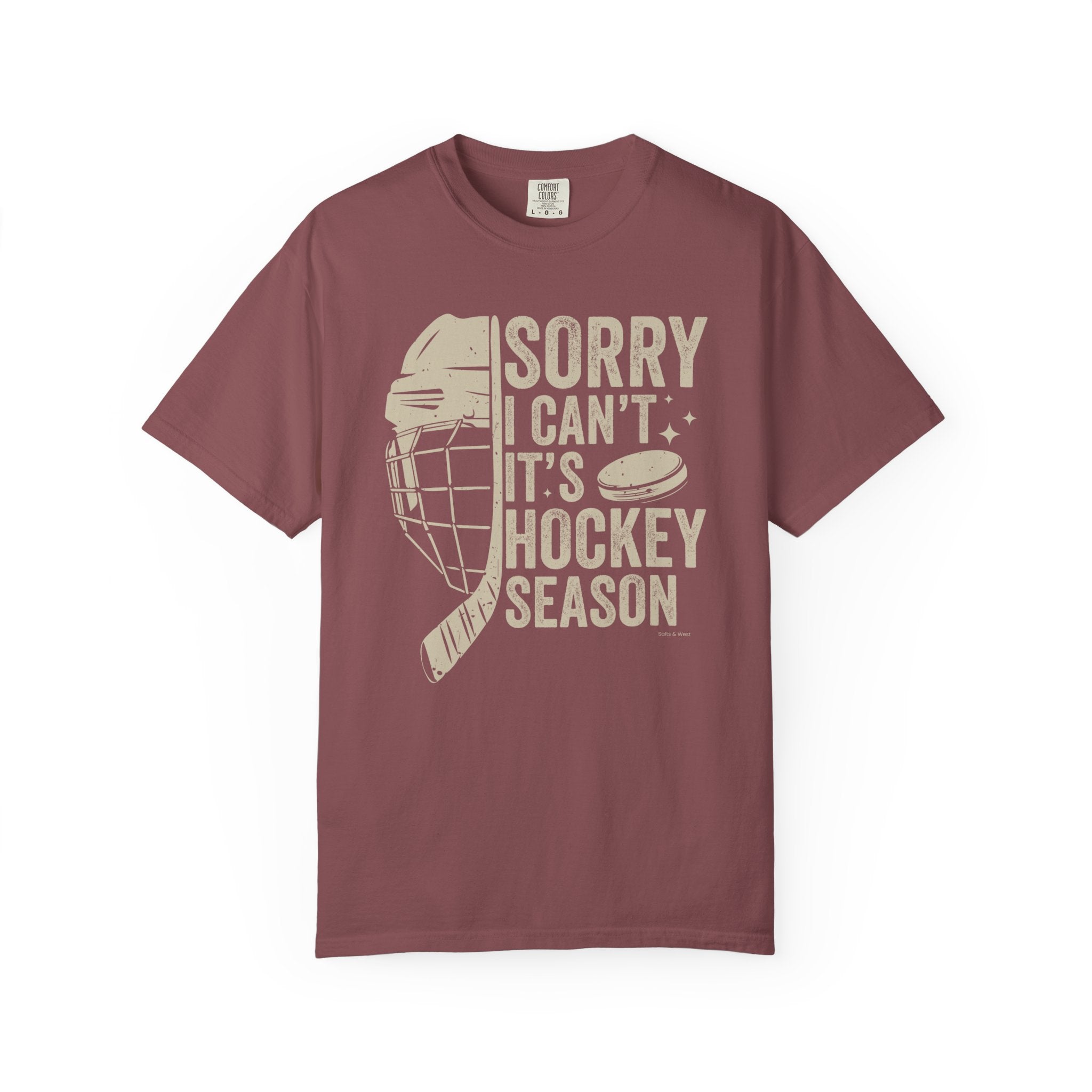 Maroon t-shirt with hockey-themed graphic and text on a white background