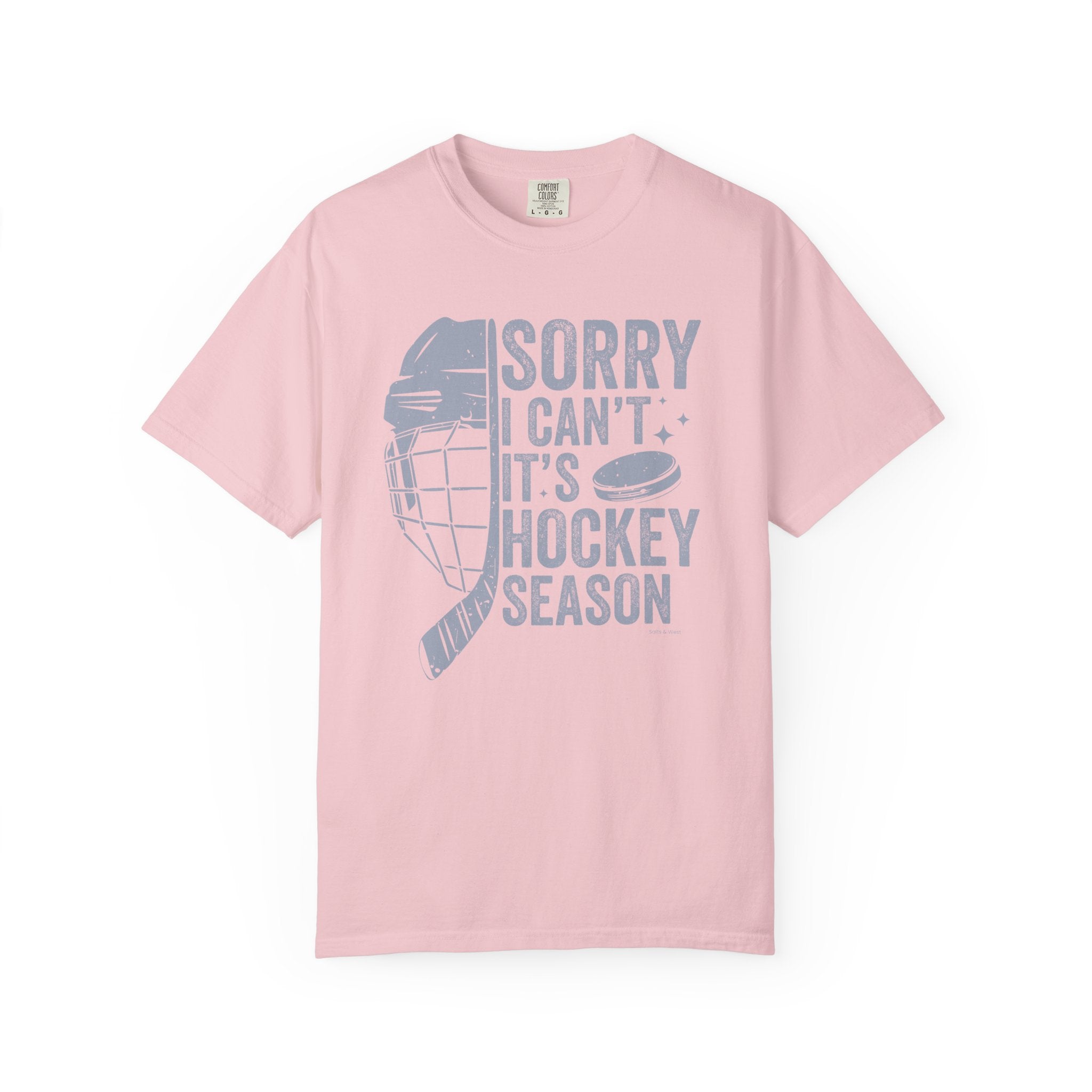 Pink t-shirt with hockey-themed graphic and text on a white background