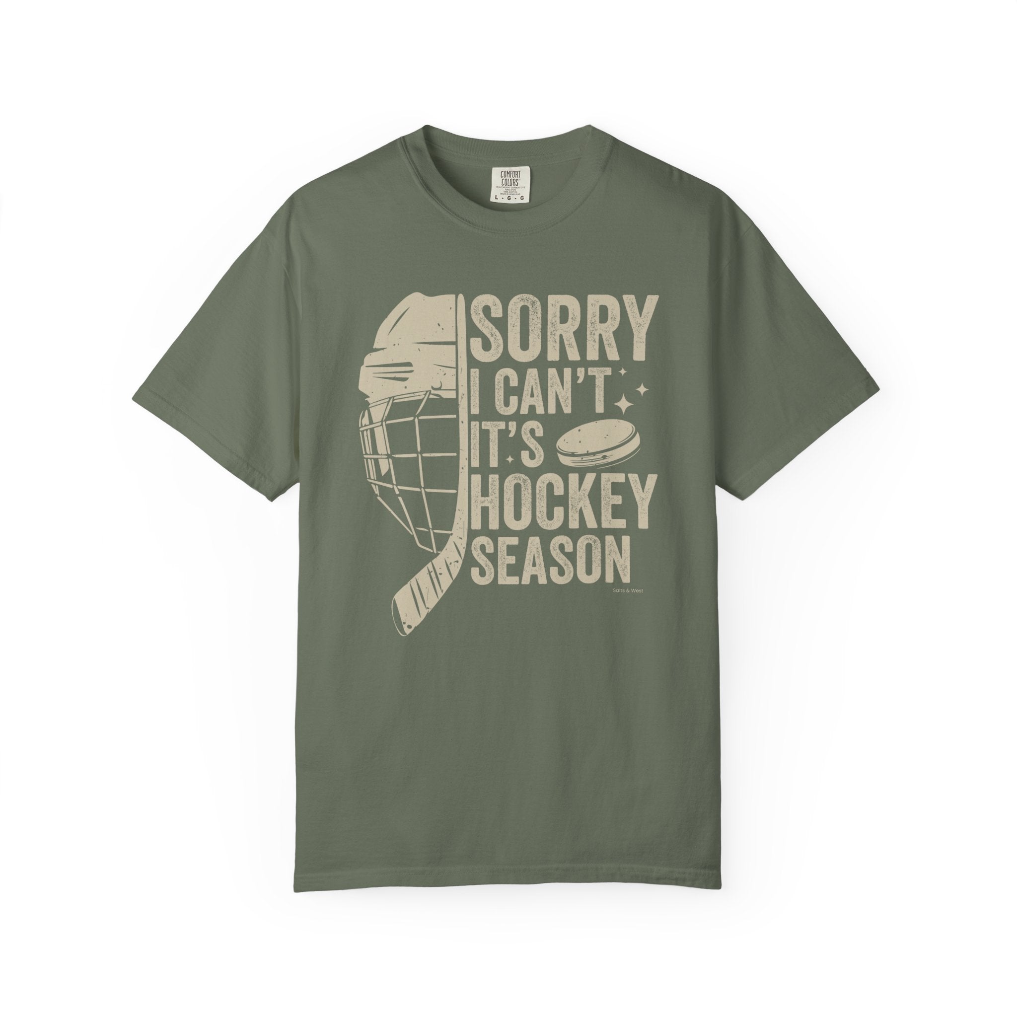 Green t-shirt with hockey-themed graphic and text on a white background