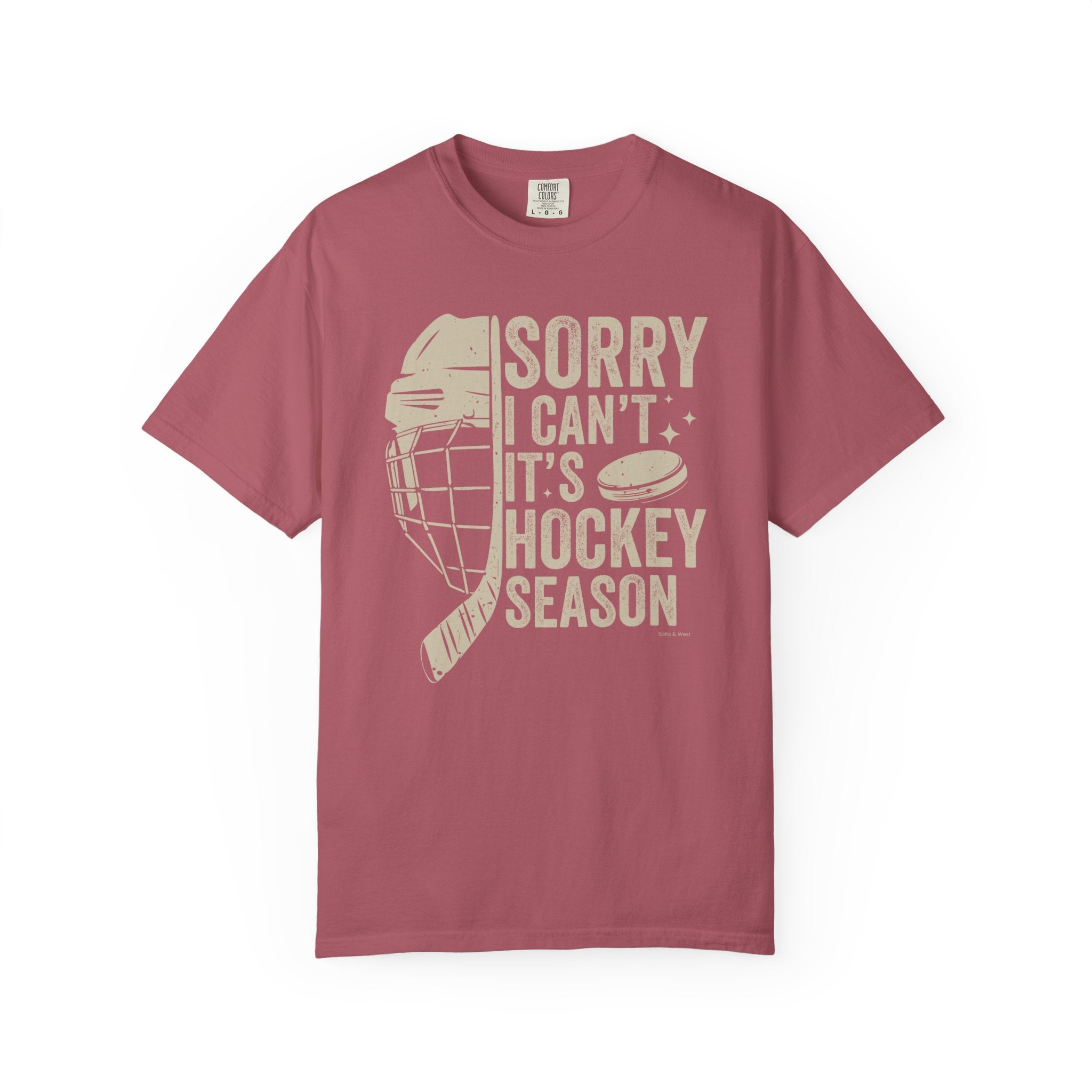 Maroon t-shirt with hockey-themed graphic and text on a white background