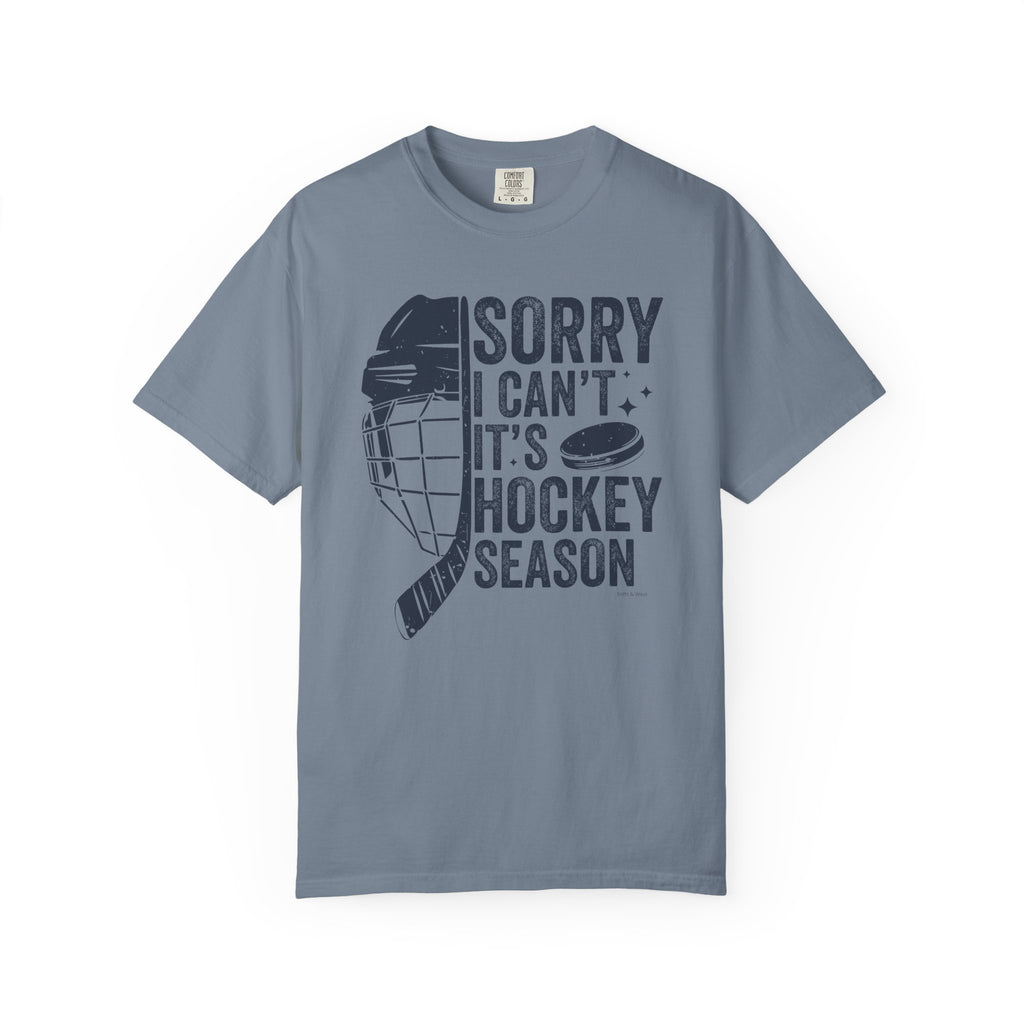 Gray t-shirt with hockey-themed graphic and text on a white background