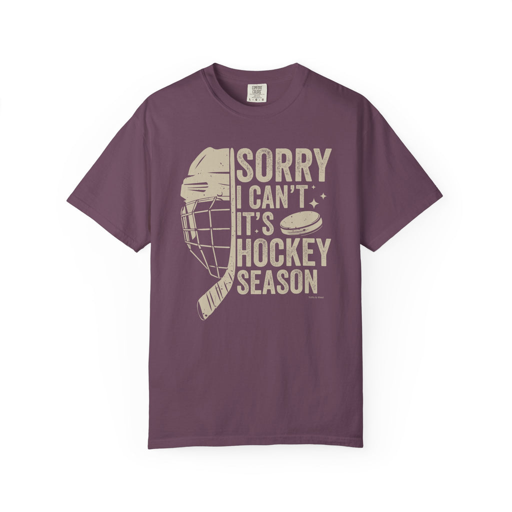 Purple t-shirt with hockey-themed graphic and text on a white background