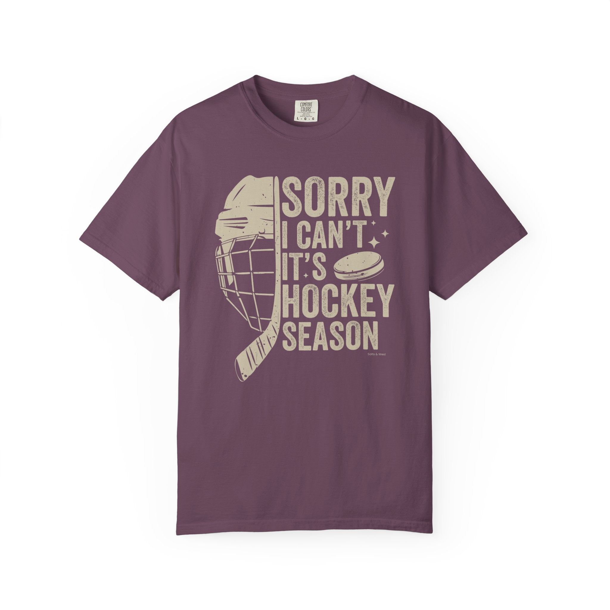 Purple t-shirt with hockey-themed graphic and text on a white background