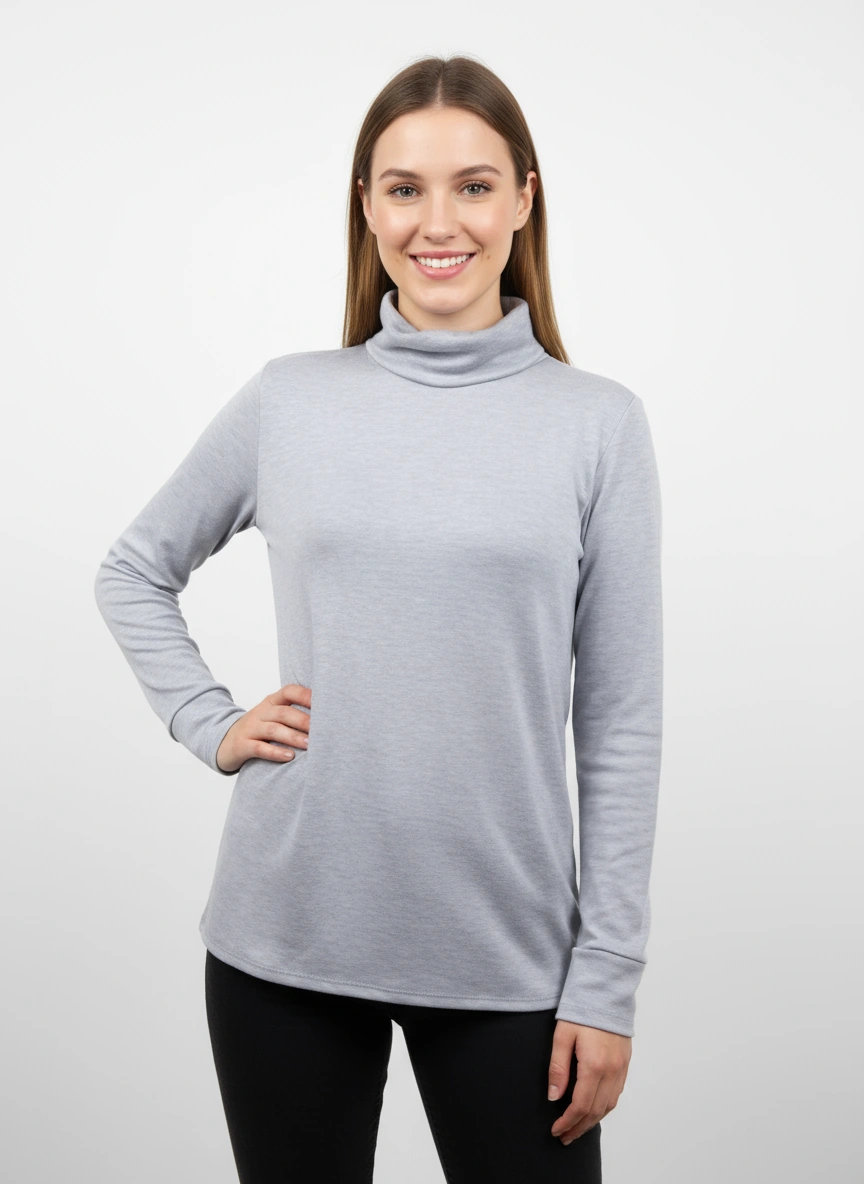 Woman wearing a gray turtleneck sweater against a white background, made in Canada clothing.