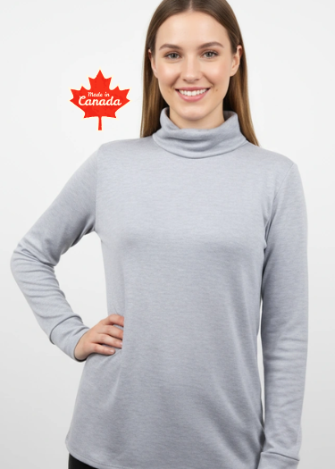 Woman wearing a gray turtleneck sweater with a Canadian flag icon on a white background