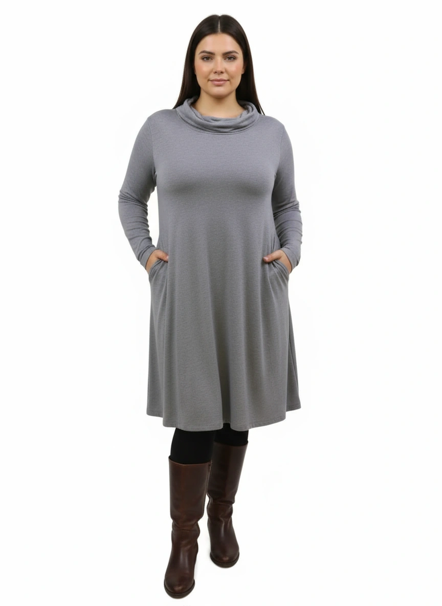 Woman wearing a gray dress with long sleeves on a white background