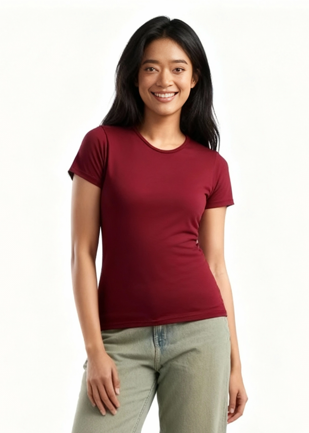 Woman wearing a wine red bamboo t-shirt and light green pants on a white background